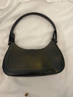 Daniela moda brand small black leather bag . Uec- one small sign of wear